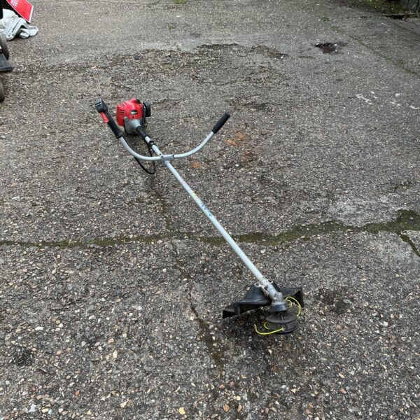 Used Robin petrol strimmer for garden landscaping.