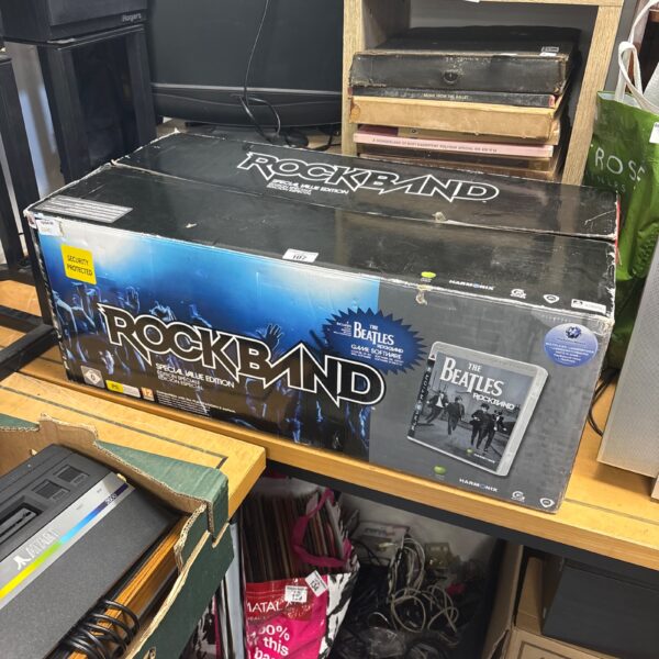 Rock Band The Beatles PS3 game lot with boxes and accessories.