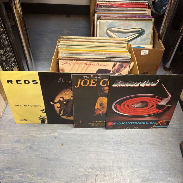 Mixed lot of rock vinyl records with Status Quo visible.