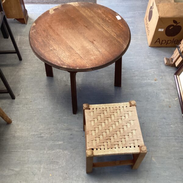Vintage round coffee table with matching footstool set.