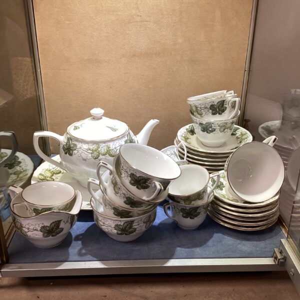 Antique Royal Worcester Hop tea service set displayed on a shelf.