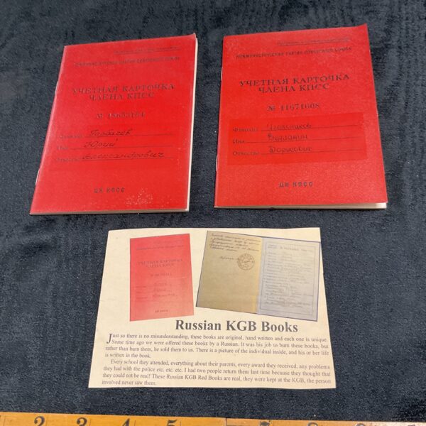 Front covers of two Russian KGB Identity Books, red and worn.