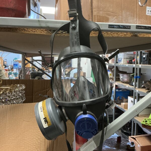 Vintage Sabre safety gas mask with clear viewing window.