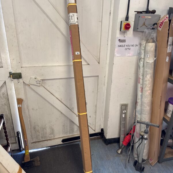Sage striped roller blind in original packaging.