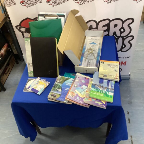 Lot of sailing and navigation handbooks with a Portland plotter.