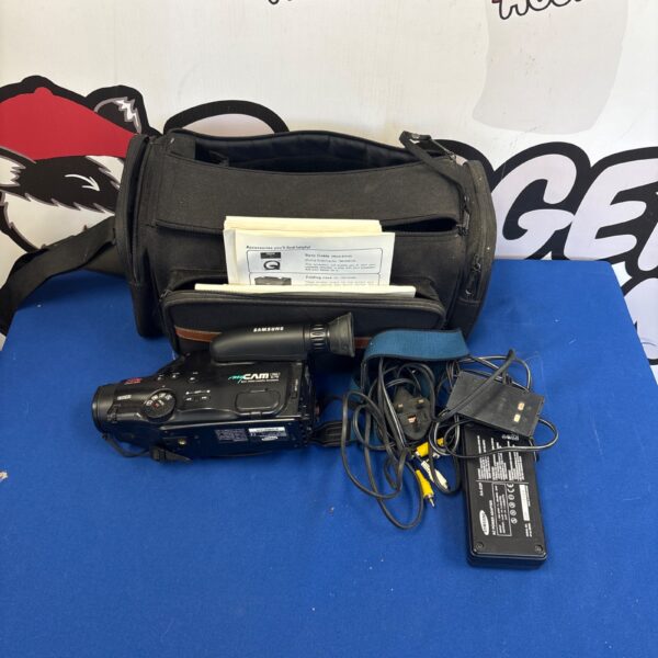 Samsung Mycam K70 video camera recorder with charger in bag.