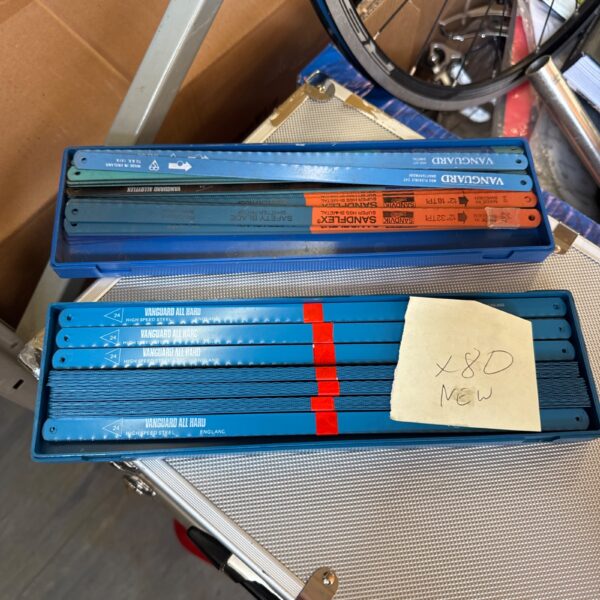 Two packs of unopened Sandvik and Vanguard 12-inch hacksaw blades.