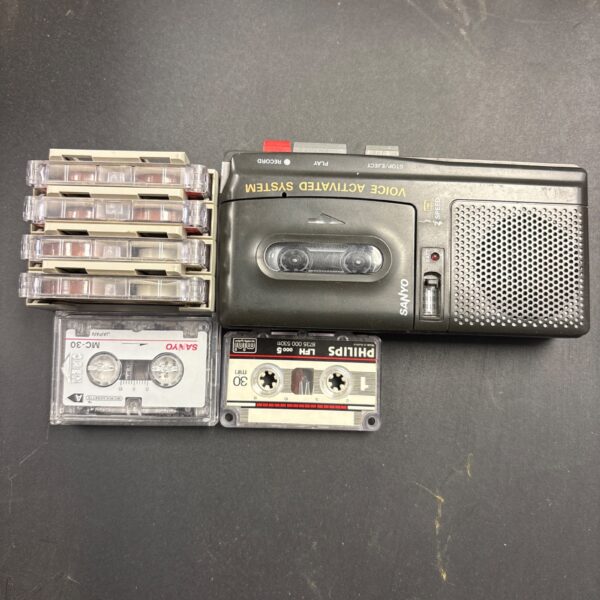 Vintage Sanyo IC-23 micro cassette recorder with tapes.