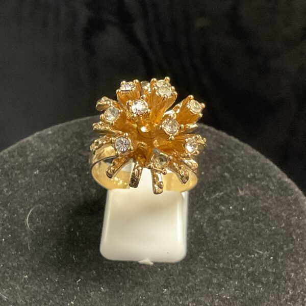 Vintage Sarah Coventry starburst ring from the 1970s with rhinestones.