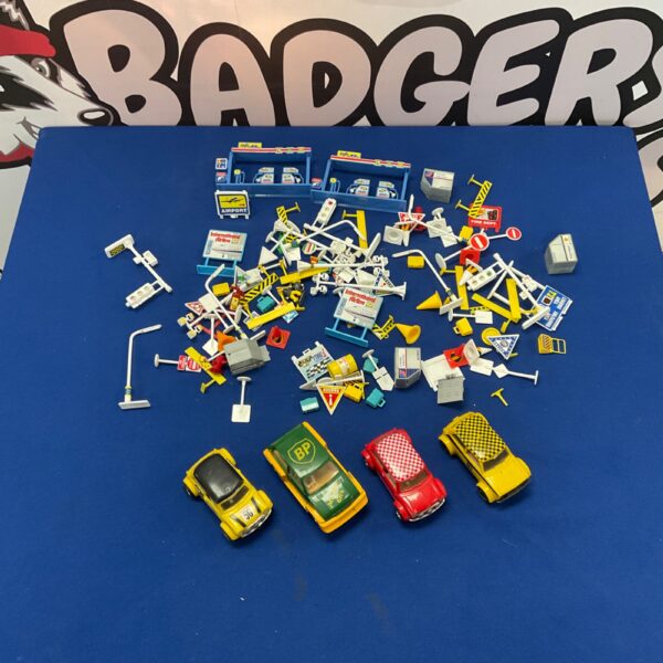 Vintage Scalextric cars and accessories in a lot.