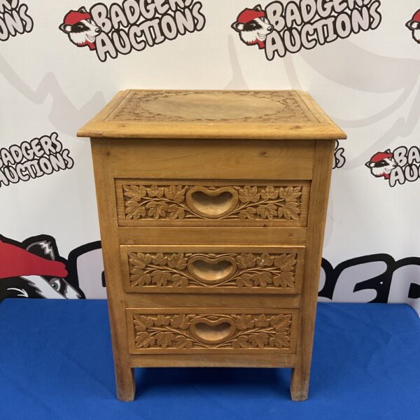 Vintage Scandinavian cabinet with carved leaf details.