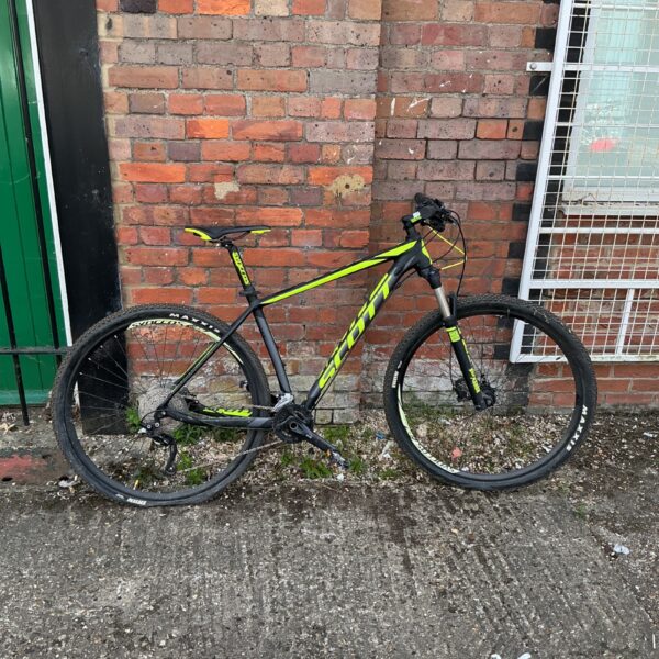 Scott Scale 1096 mountain bike on a brick wall.