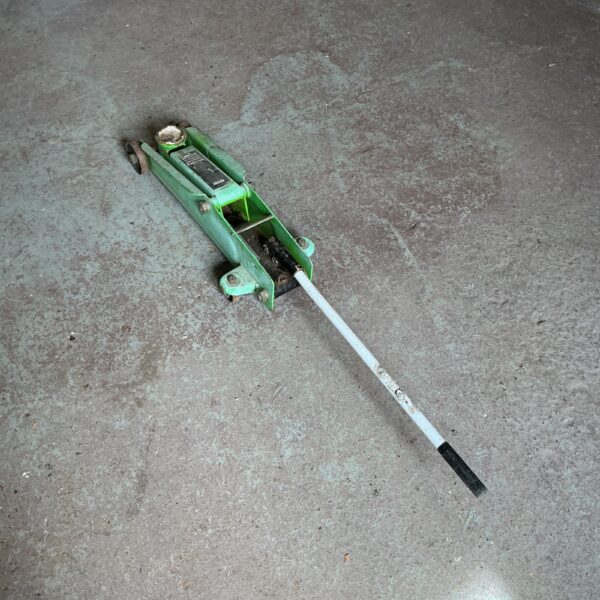 Sealey 3 tonne trolley jack for automotive repairs.