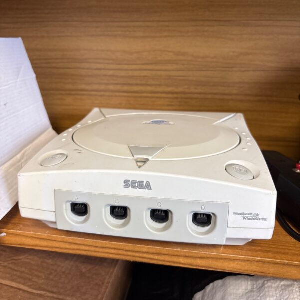 Front view of a Sega Dreamcast console, a retro gaming system.