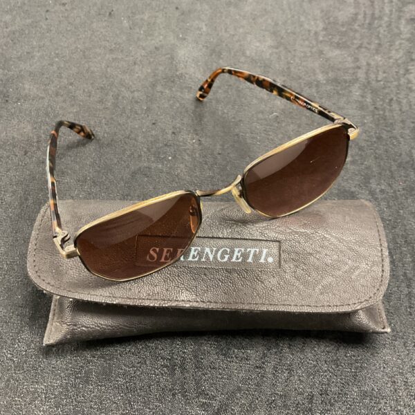 Vintage Serengeti sunglasses with case, classic 1980s eyewear.