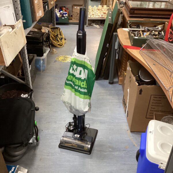 Used Shark upright vacuum cleaner for floor cleaning.