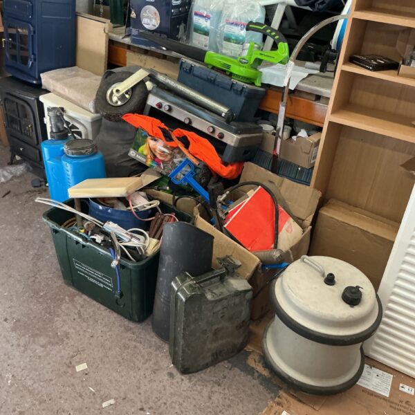 Mixed shed clearance lot with camping and garden tools.