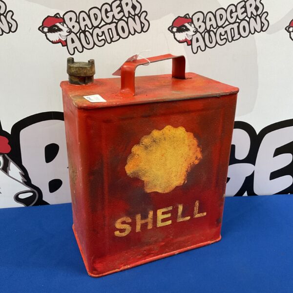 Red reproduction Shell fuel can with brass cap.