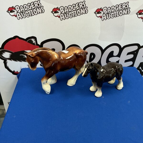 Pair of porcelain Shire horse figurines for collectors.