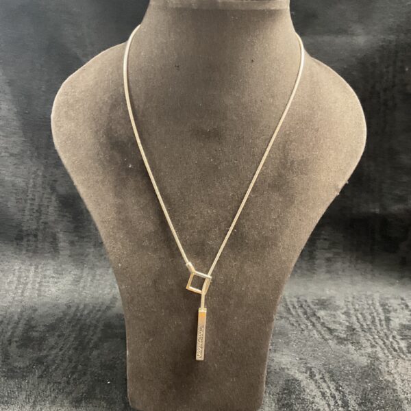 Vintage Sidney Carron necklace with geometric pendant.