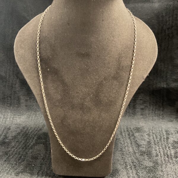 Close-up of a 925 silver anchor chain necklace.