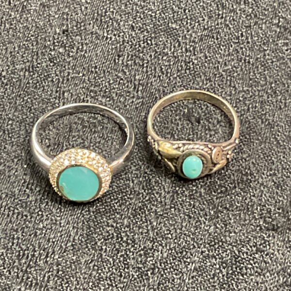 Two 925 silver rings with vibrant blue stones.