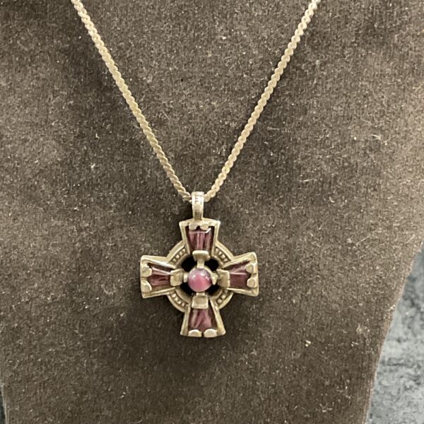 Vintage silver Celtic cross pendant with amethyst gemstones.
