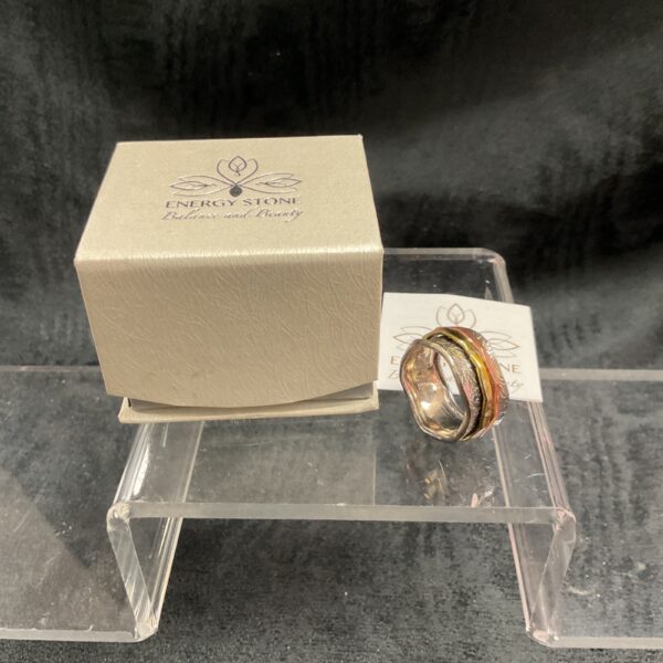 Silver energy stone ring with spinning elements, size V.