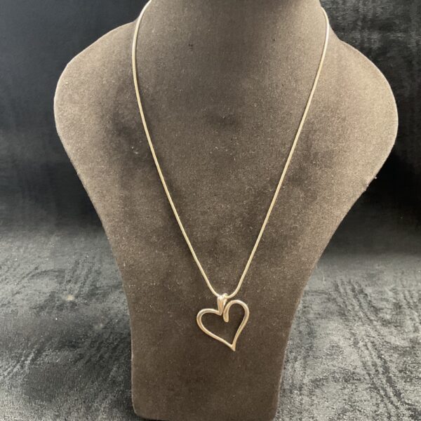 Delicate 925 silver heart pendant on a snakelink chain necklace.