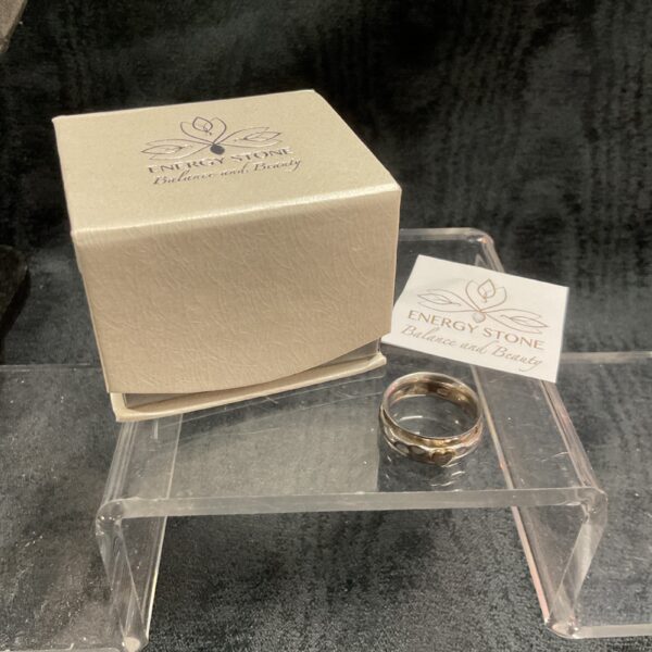 Silver heart spinner ring with rotating inner hearts.
