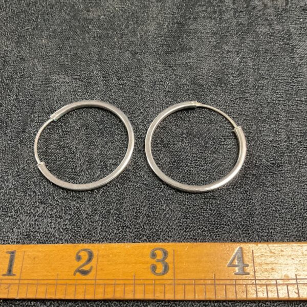Pair of elegant 925 silver hoop earrings, minimalist design.
