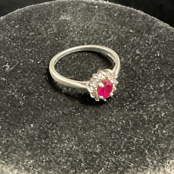 Silver ring with a vibrant red stone cluster.