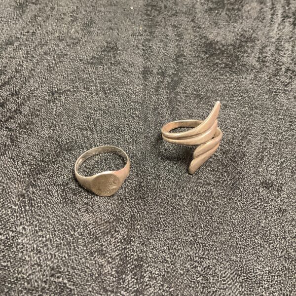 Close-up of a pair of minimalist 925 silver rings.