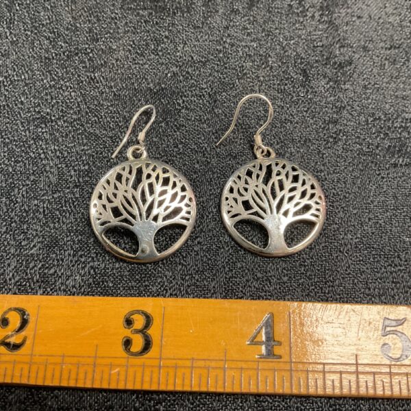 Delicate silver tree of life dangle earrings, detailed design.