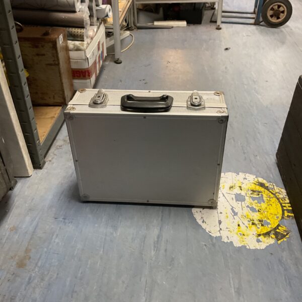 Silver utility flight case for equipment protection and travel.