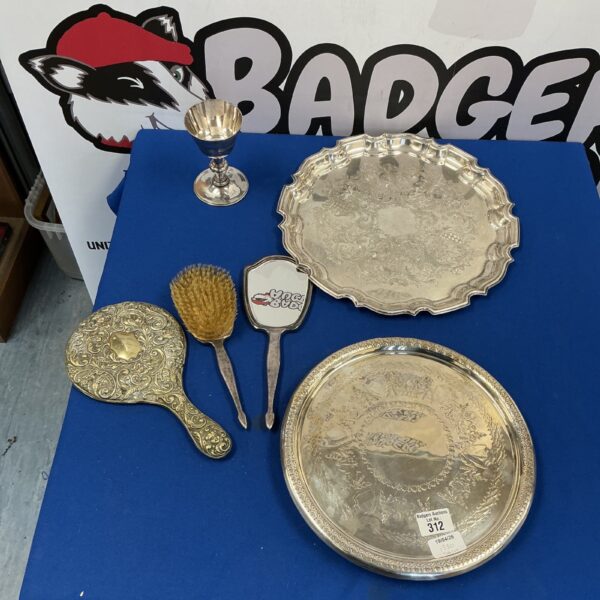 Vintage silverplate vanity set with floral embossed details.