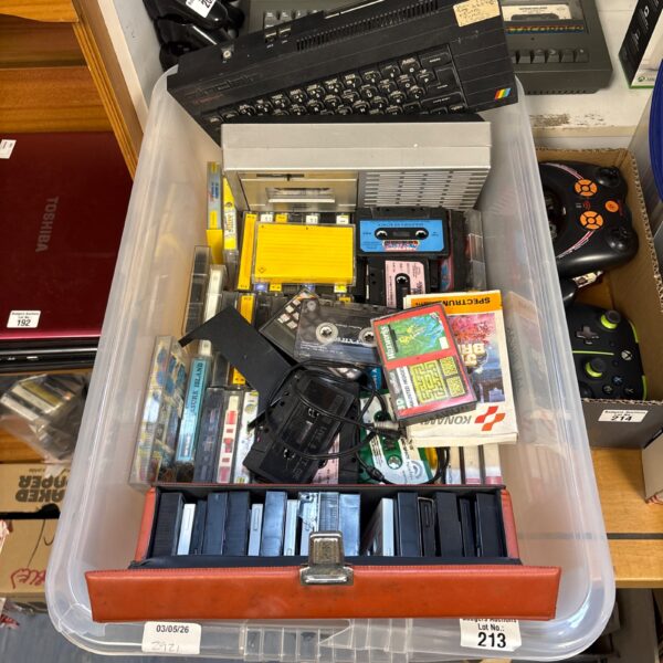 Vintage Sinclair ZX Spectrum computer with games and tapes.