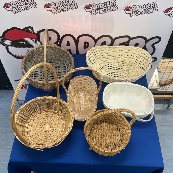 Six vintage wicker baskets displayed together.