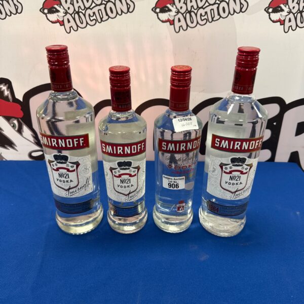 Sealed lot of four Smirnoff vodka bottles for collectors.