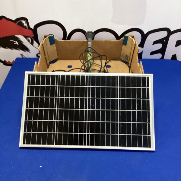 Rectangular solar panel for a pond pump water feature.