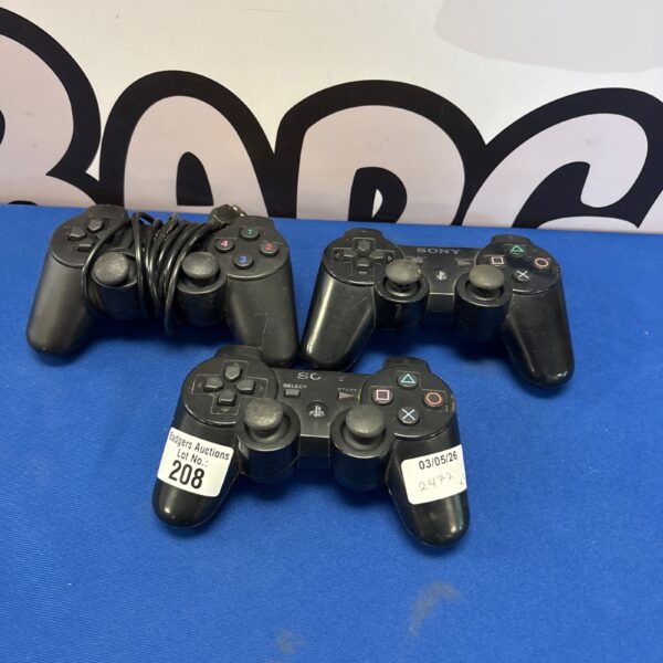 Three Sony DualShock 3 controllers for PlayStation 3 gaming.