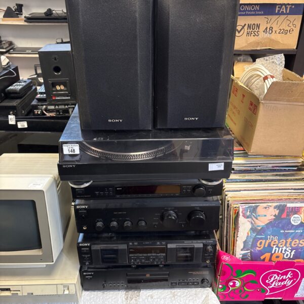 Black Sony hifi system with speakers and manuals.