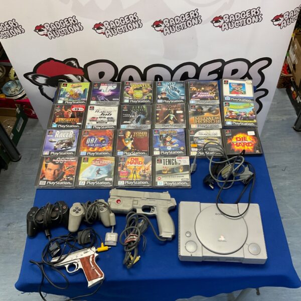 Vintage Sony Playstation 1 console with games and accessories.