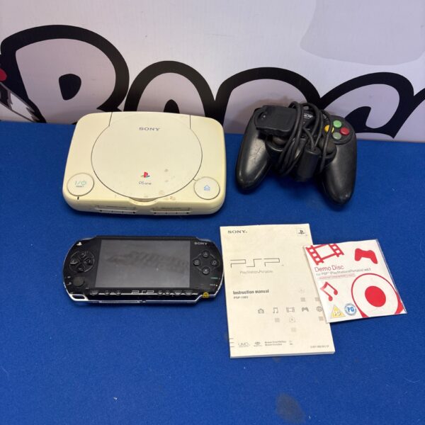 Vintage Sony PS1 and PSP console bundle for retro gaming enthusiasts.