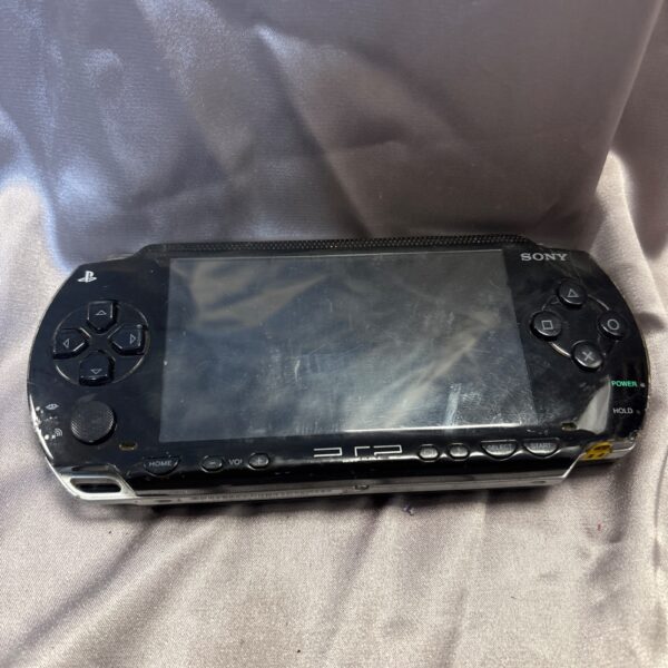 Vintage Sony PSP 1003 handheld gaming console for retro gaming.
