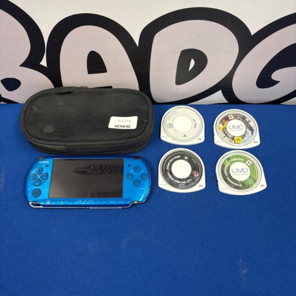 Blue Sony PSP 3003 handheld console with included games.
