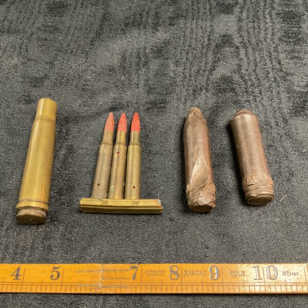 Close-up of spent bullet shells and recovered tips, ammunition relics.
