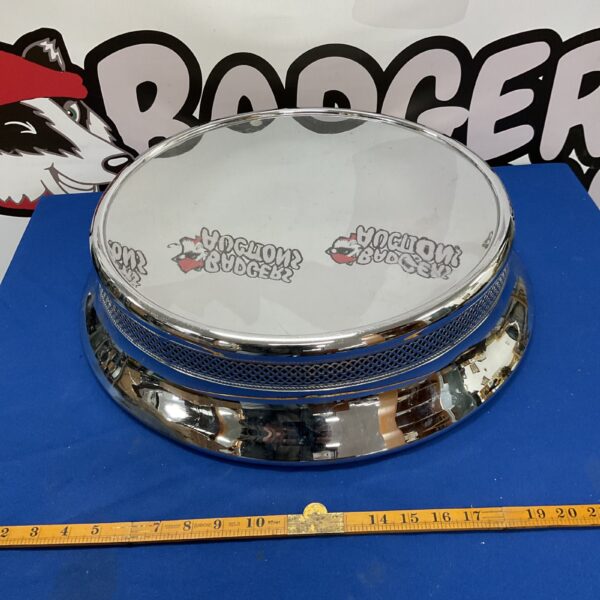 Large stainless steel cake base for wedding or tiered cakes.