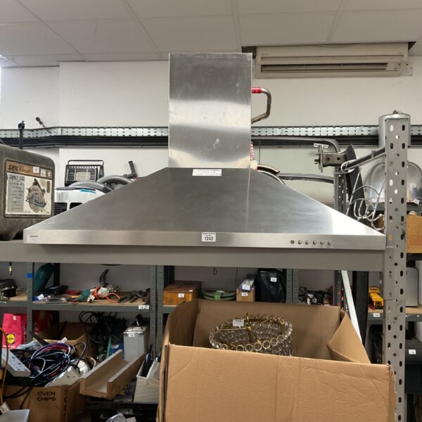 Stainless steel extractor hood for commercial kitchen ventilation.