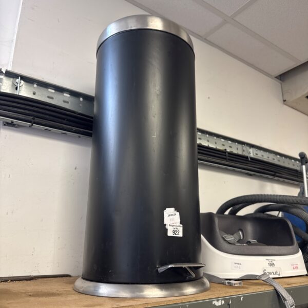 Stainless steel kitchen pedal bin for convenient waste disposal.